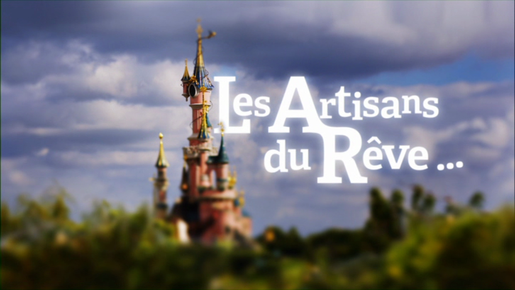 Castle with the words 'Les Artisans du Reve' next to it.