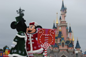 Mickey and Minnie kissing in front of the castle